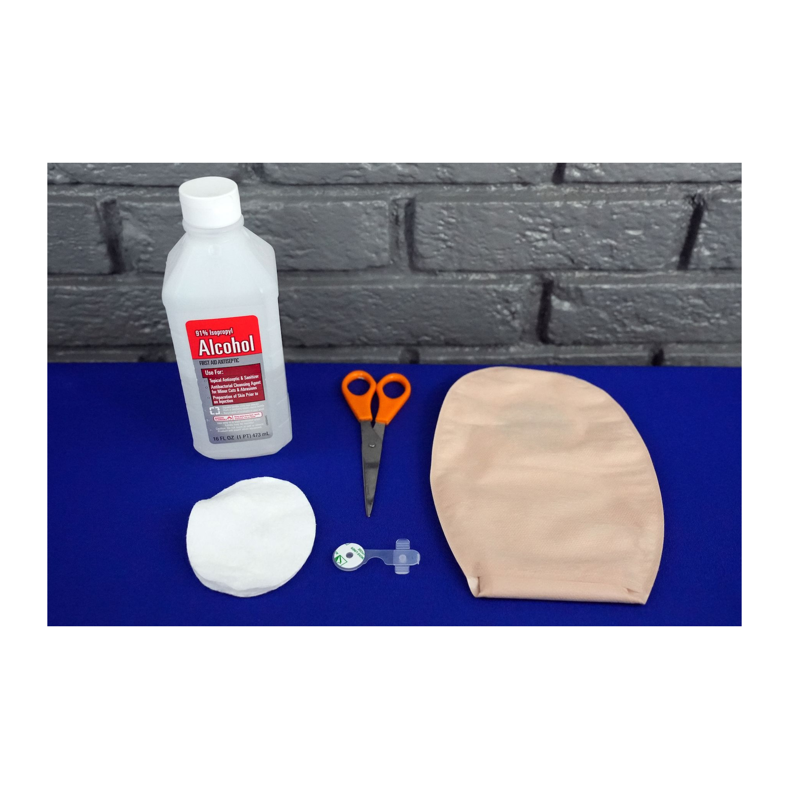 Items used to attach an Osto-EZ-Vent to an ostomy pouch